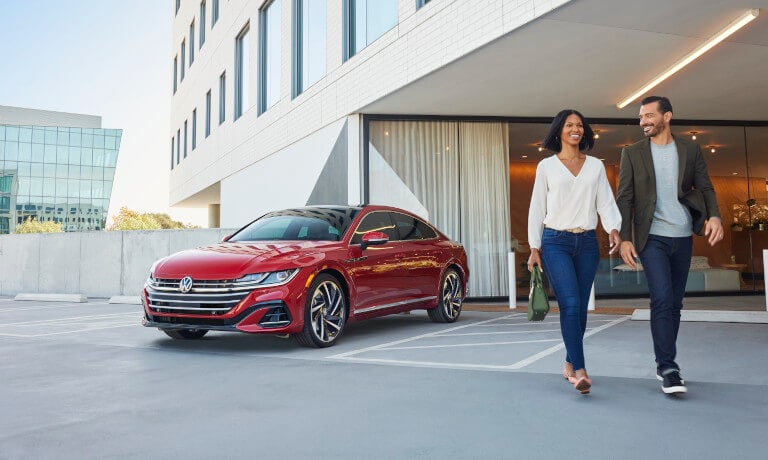 2022 VW Arteon Exterior Parked By Hotel Lobby With Friends Walking