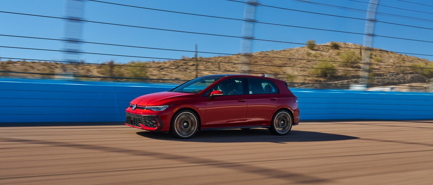 2026 Volkswagen Golf GTI Exterior Driving Fast On Bridge