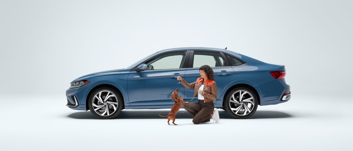 2025 Volkswagen Jetta Exterior Side View With Woman And Dog