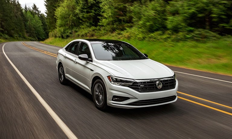 2021 Volkswagen Jetta Exterior Driving On A Forest Road