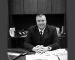 Staff member BRETT SCHNEIDER from ID_1a5128d3c58c