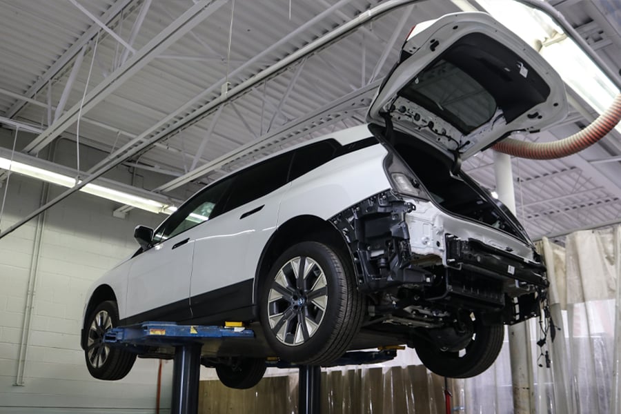 Electric vehicles undergoing expert repair and maintenance at Patrick Collision Center in Schaumburg and Naperville
