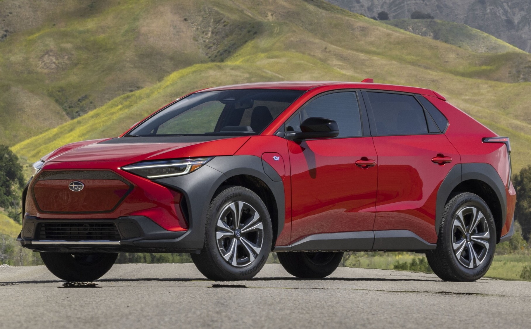  Person cheerfully signing documents.