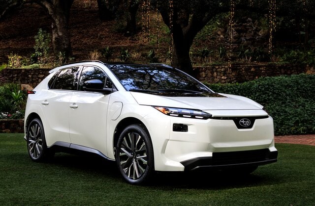  Person cheerfully signing documents.