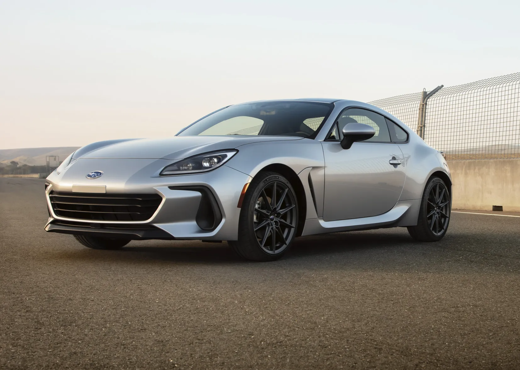  Person cheerfully signing documents.