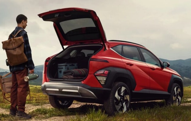  Person cheerfully signing documents.