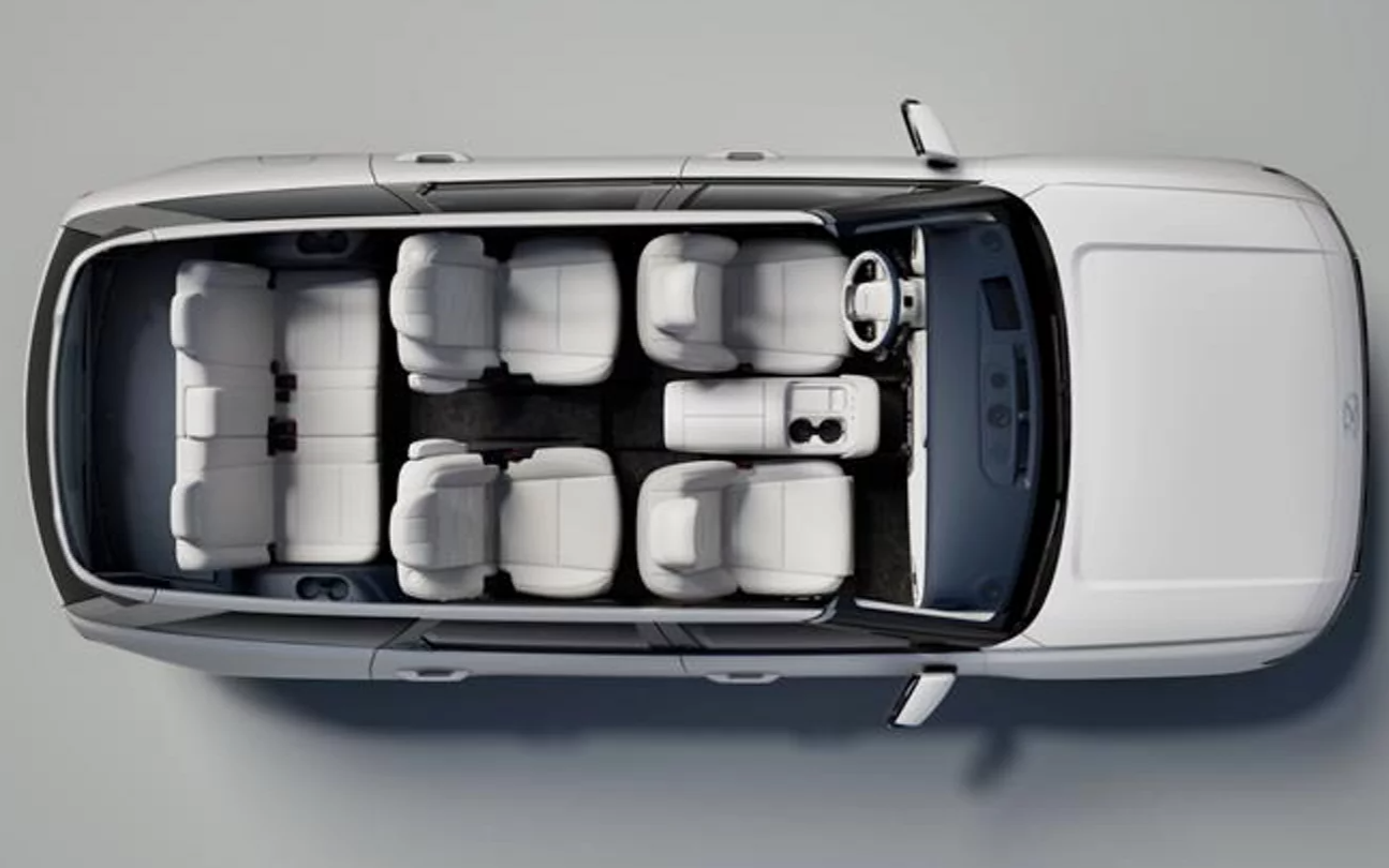  Person cheerfully signing documents.