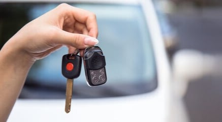  Person cheerfully signing documents.