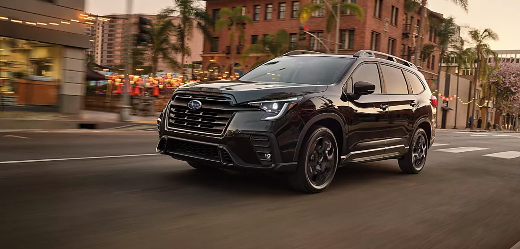 New Subaru SUV driving through old town