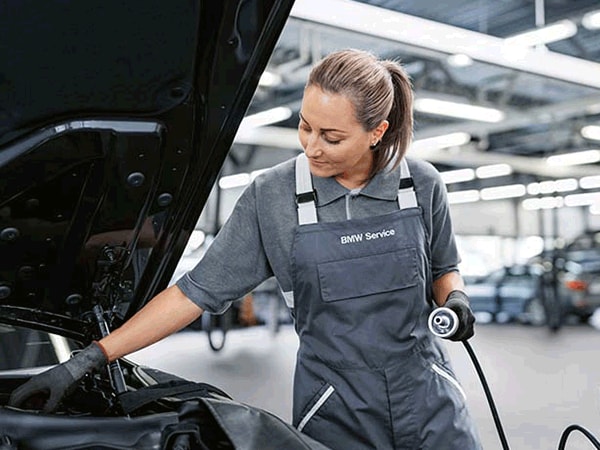 BMW technician performing engine service at Thompson BMW in Doylestown, PA