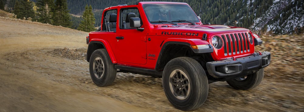 Jeep Wrangler Off-Roading on Dirt Road