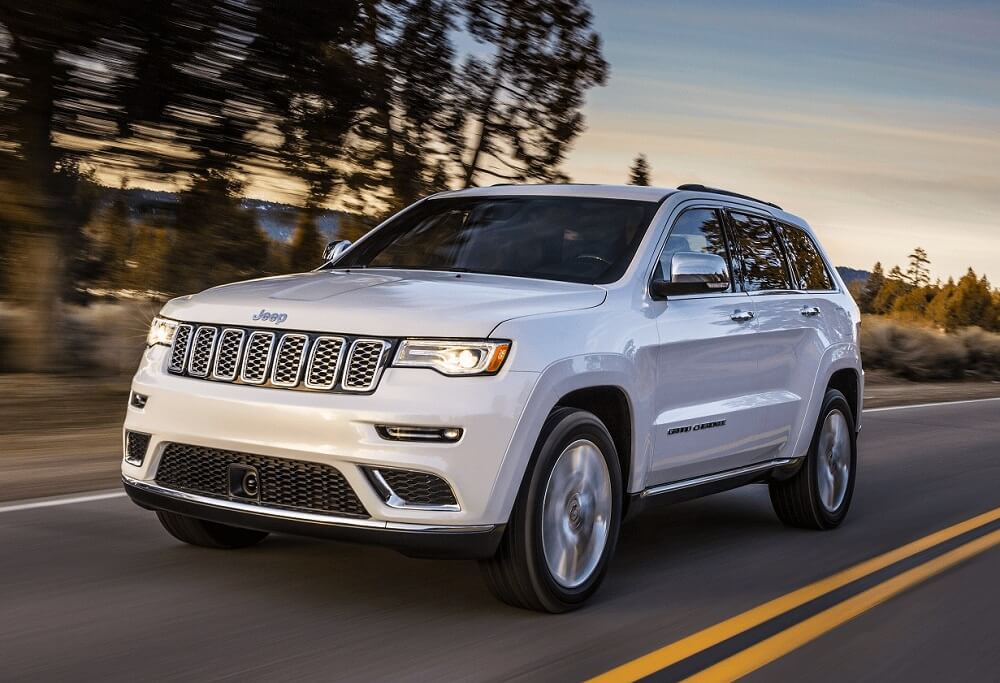 White Jeep Grand Cherokee on highway
