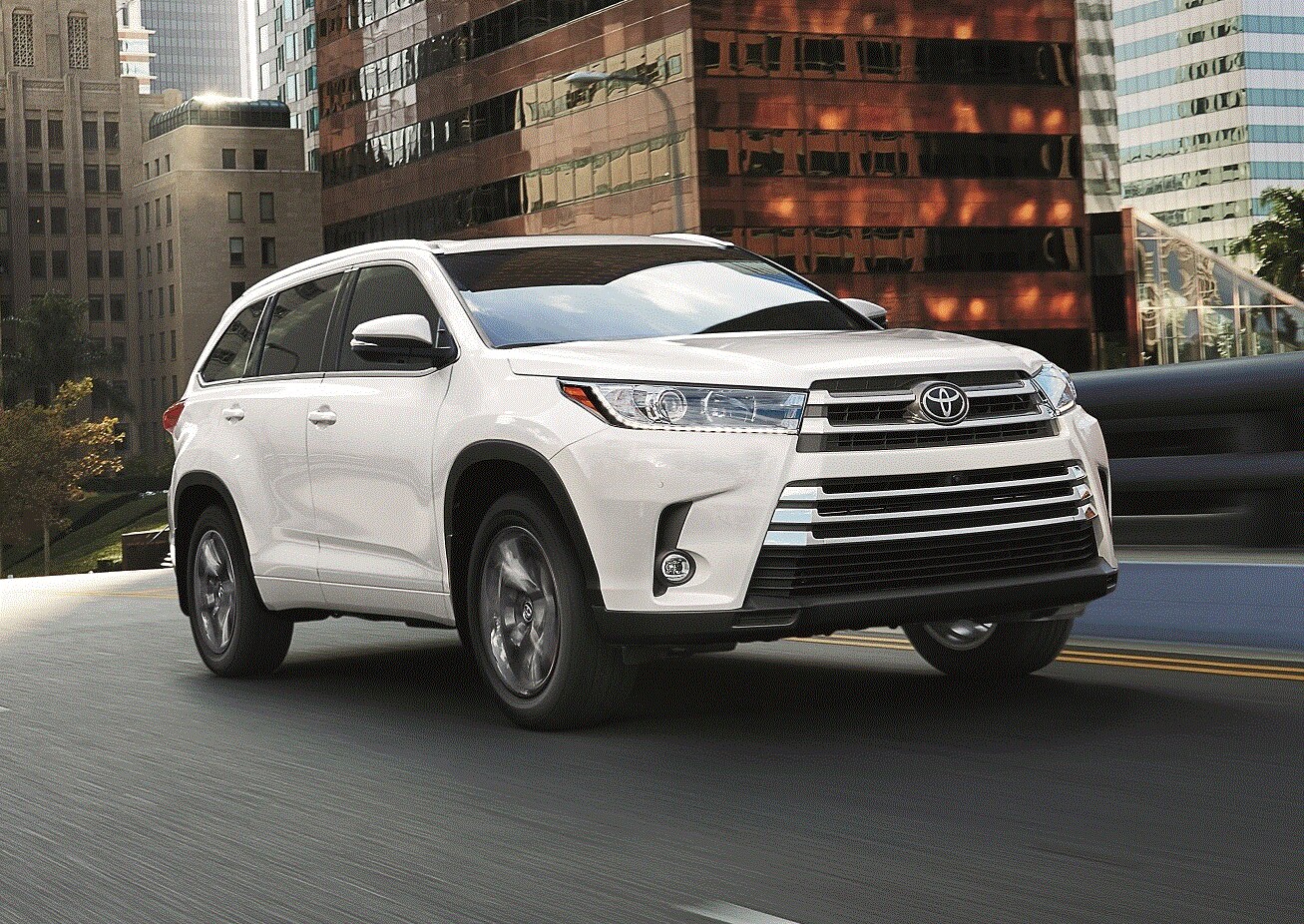 White Toyota Highlander Engine on City Street