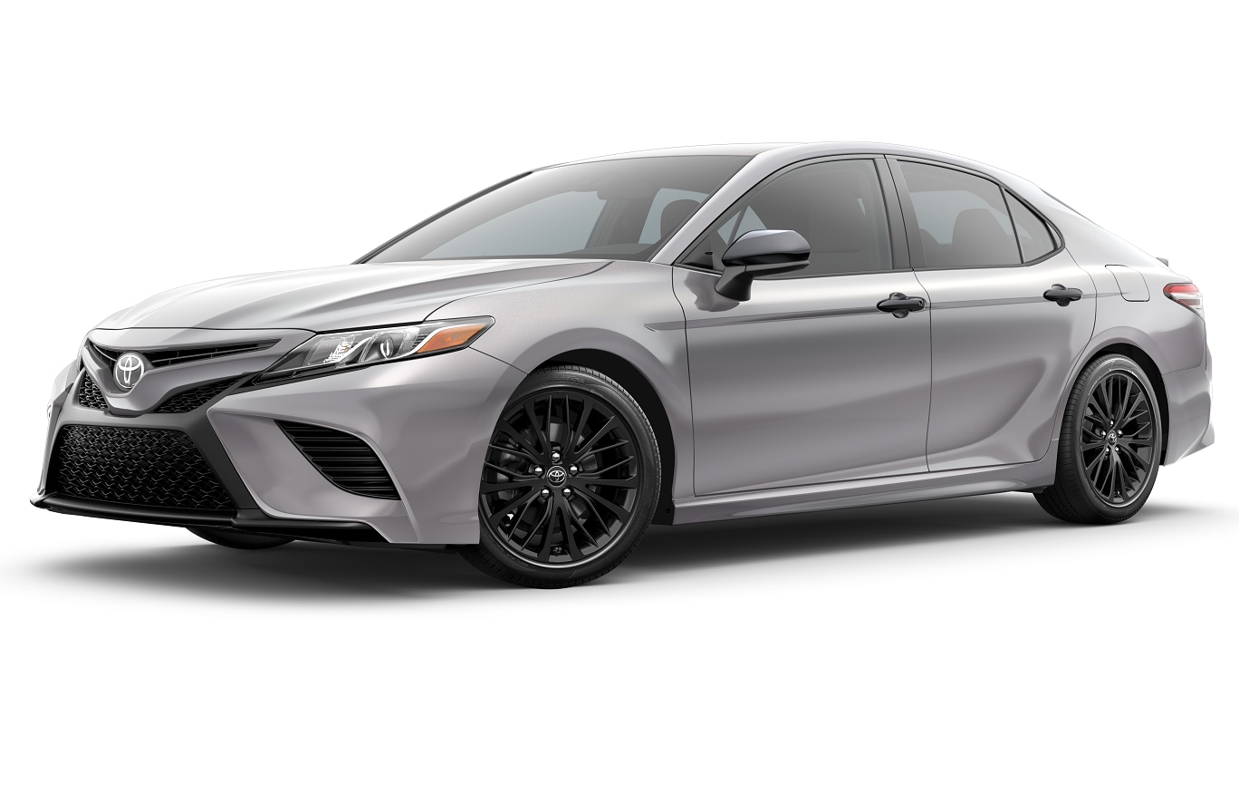 Silver Toyota Camry with white background shot from driver's side.