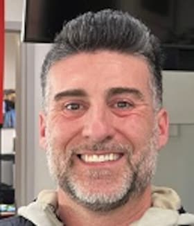 Staff member Justin Dominiak from 8fa8d2ebc44d