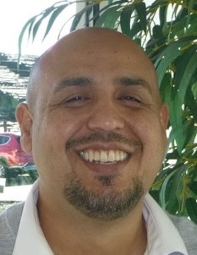Staff member Enrique Muniz from 8fa8d2ebc44d
