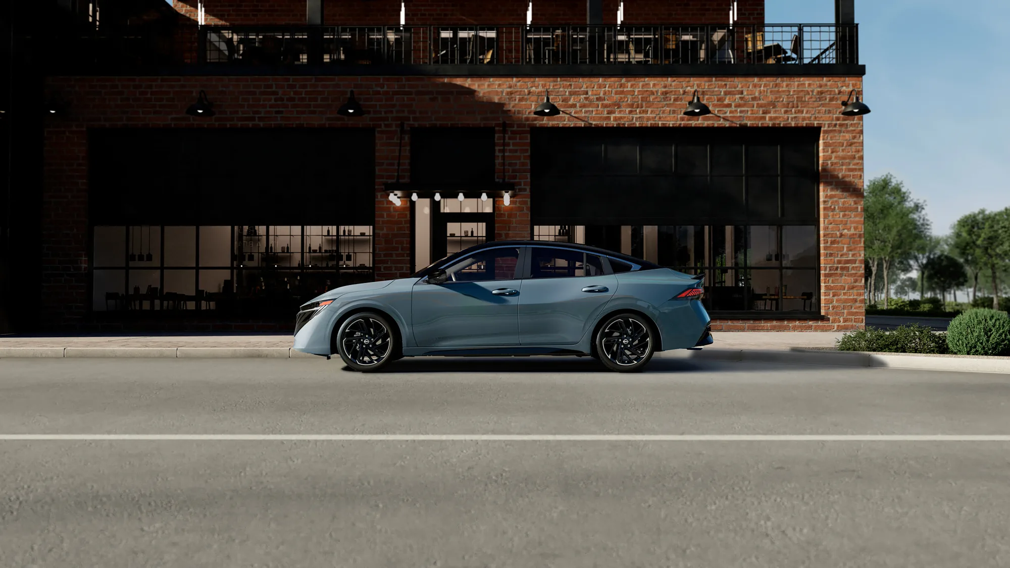 Light gray vechicle parked in front of a brick building