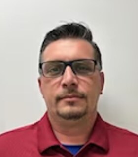 Staff member Andrew Diedrich from ID_829283