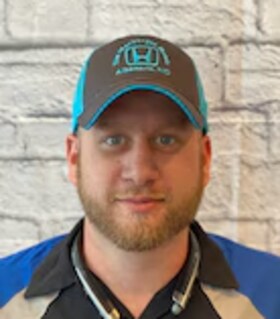 Staff member Brandon Kimrey from ID_829283
