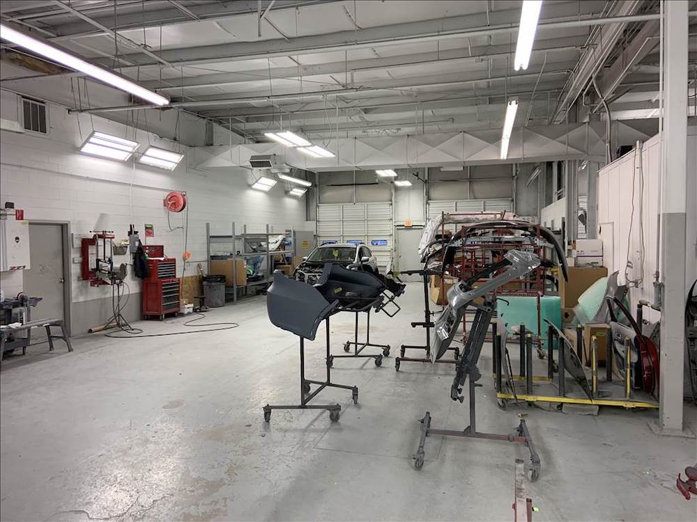  Inside Collision Center with car body frames