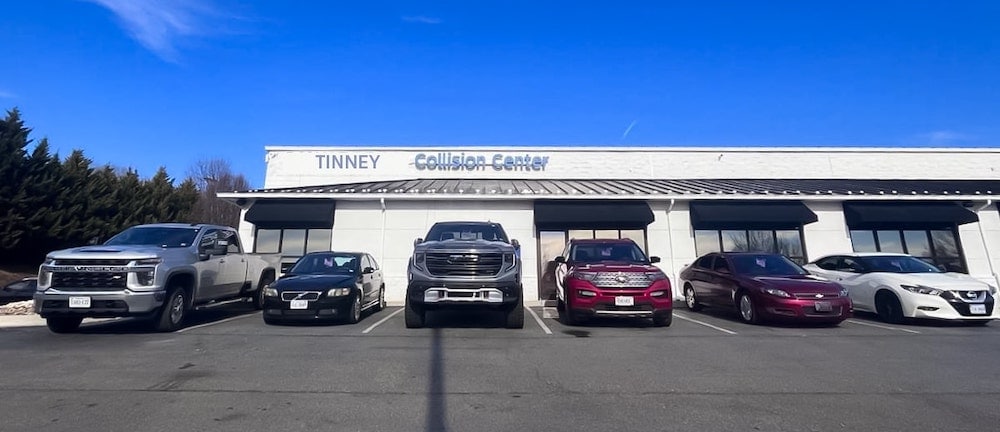 Store Front Image of Tinney Chevy GMC building with models in front