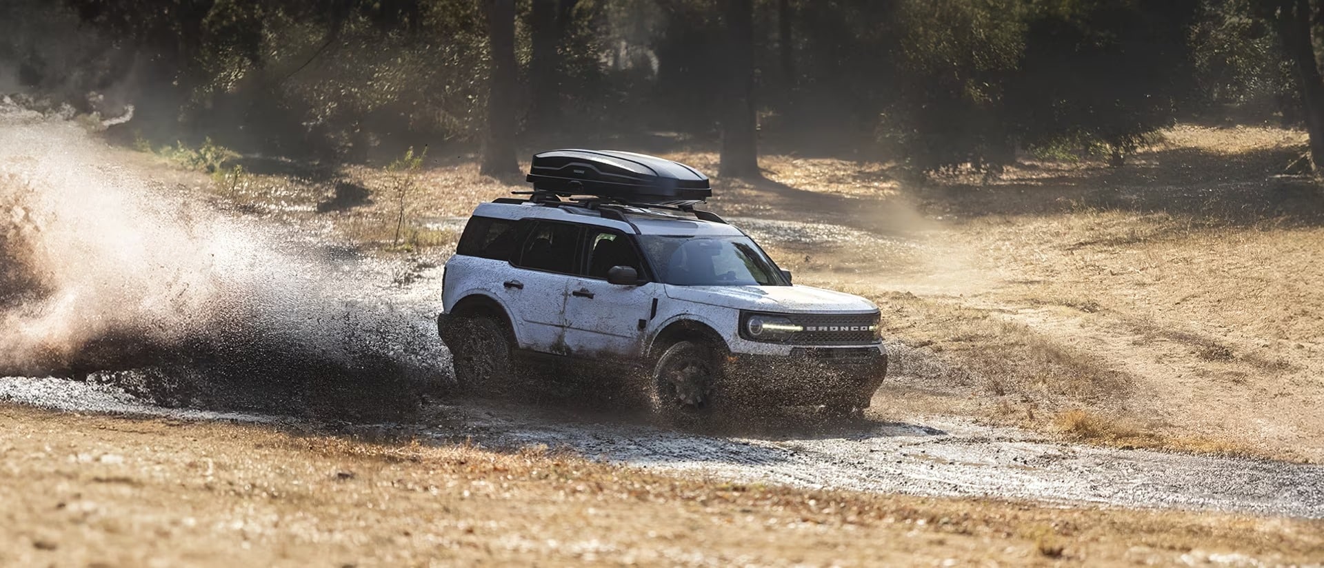 2025 Ford Bronco Sport in action off-roading in the mud.