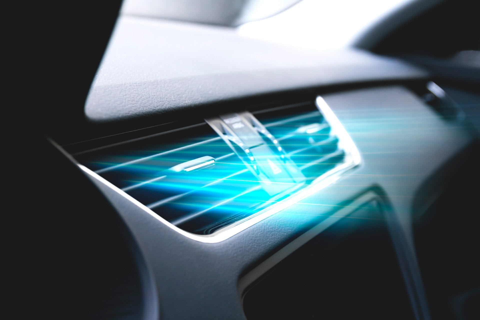  Bright blue air coming out of a car's air conditioning vent