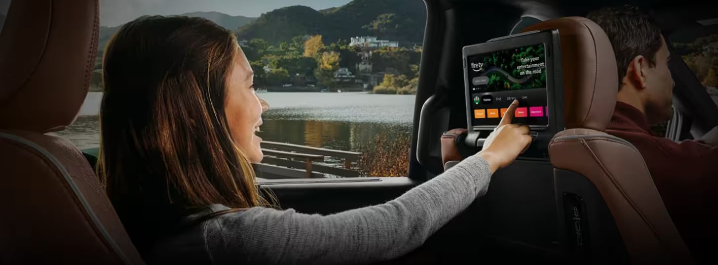 A passenger using the rear-seat entertainment in the 2024 Chrysler Pacifica