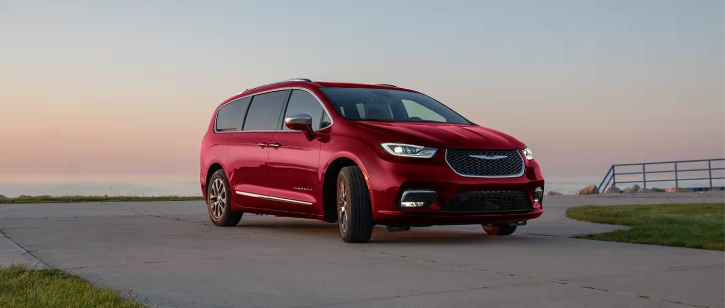 2024 Chrysler Pacifica Plug-in Hybrid in red parked on concrete