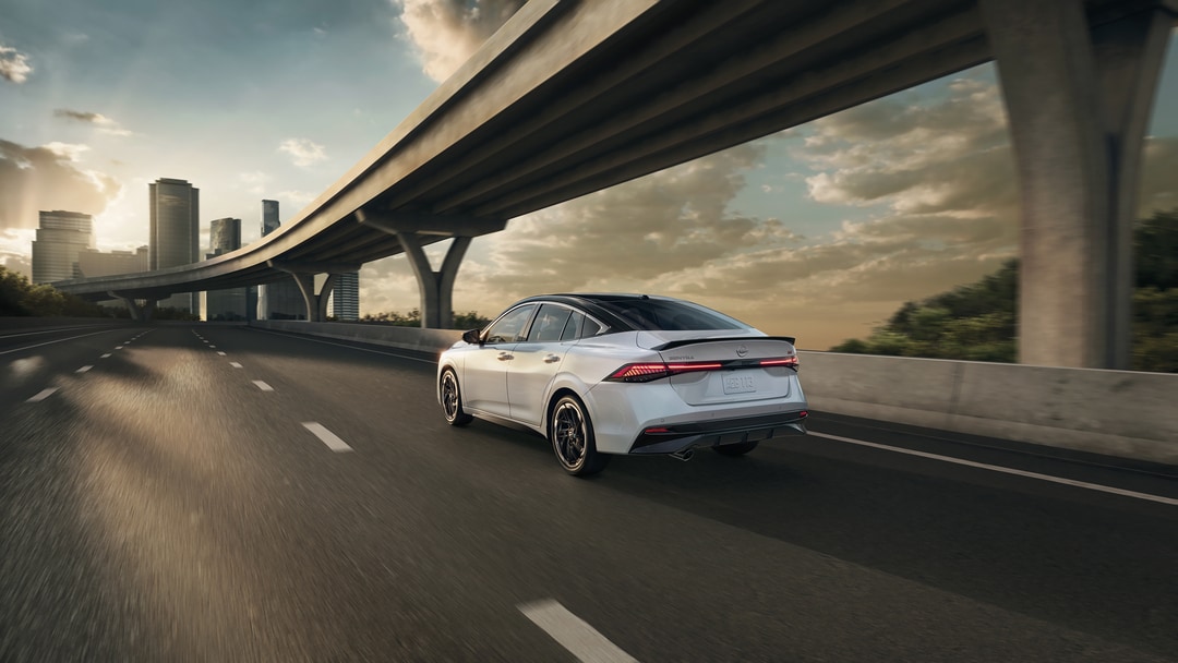  New Nissan Sentra side view with family getting inside