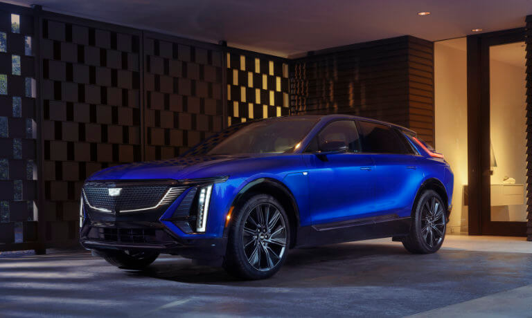 2025 Cadillac LYRIQ charging in covered driveway
