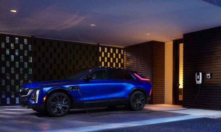2025 Cadillac LYRIQ charging on covered driveway