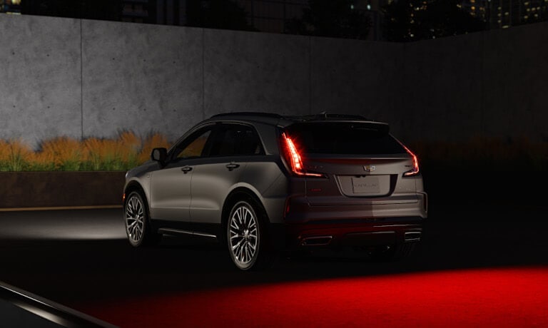 2025 Cadillac XT4 with tail lights on at night