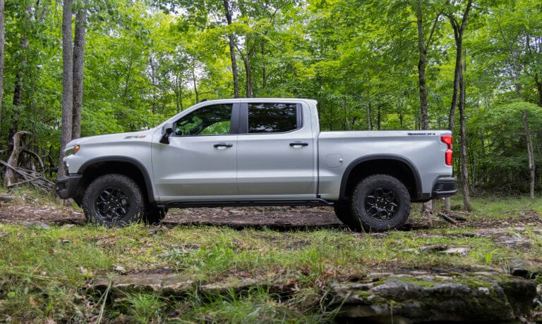 2025 Chevy Silverado 1500 side view in forest