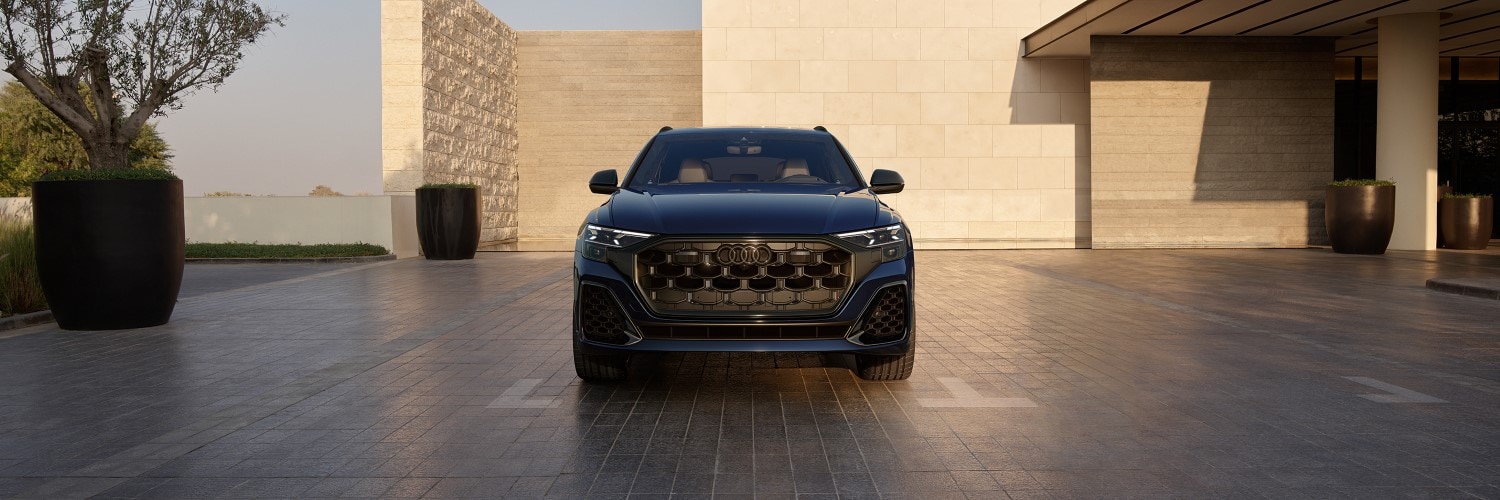 Audi SQ8 Prestige driving on a road at night