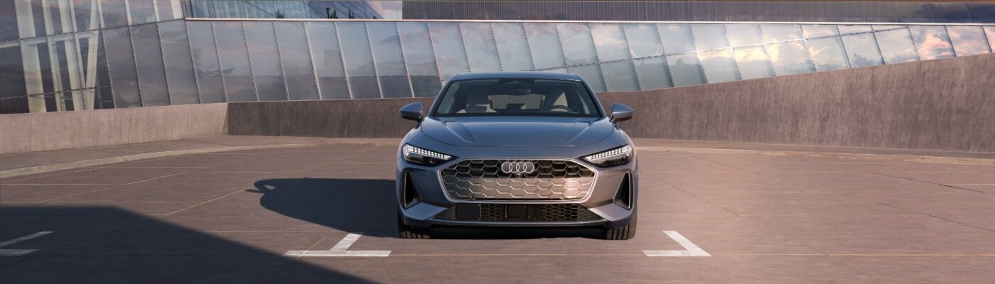 Grey Audi A5 Sportback parked in front of a house