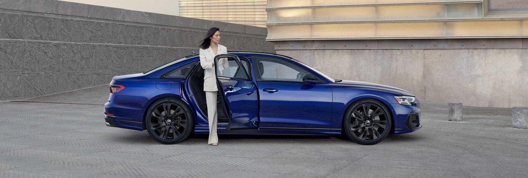 Audi S8 in profile driving on a mountain road