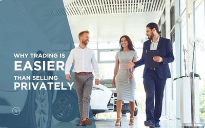 Couple meeting with a Tom Wood advisor while trading in their vehicle in Indiana