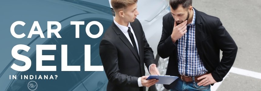 Person reviewing paperwork to sell their car fast in Indiana with Tom Wood Automotive Group