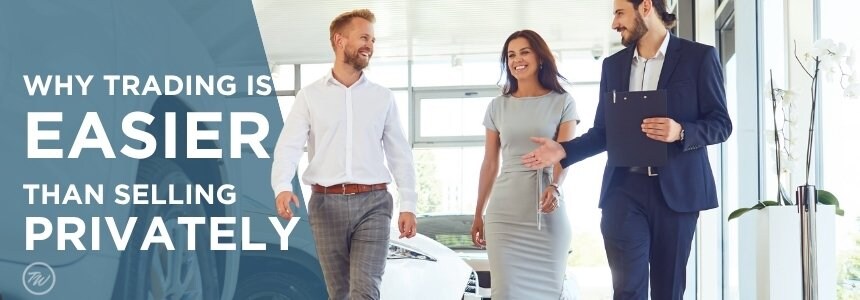 Couple meeting with a Tom Wood advisor while trading in their vehicle in Indiana