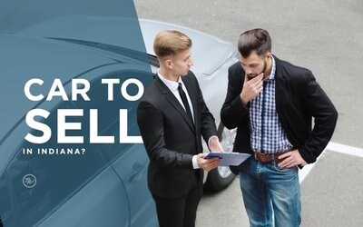 Person reviewing paperwork to sell their car fast in Indiana with Tom Wood Automotive Group