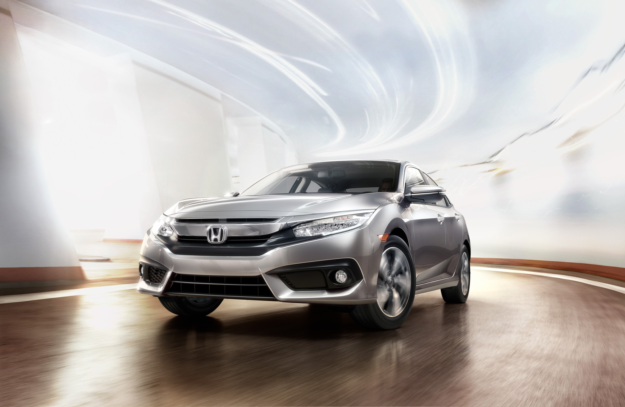 16-17_Civic_Sedan_Touring_Location_CurvedRoad_LunarSilverMetallic-3.jpg