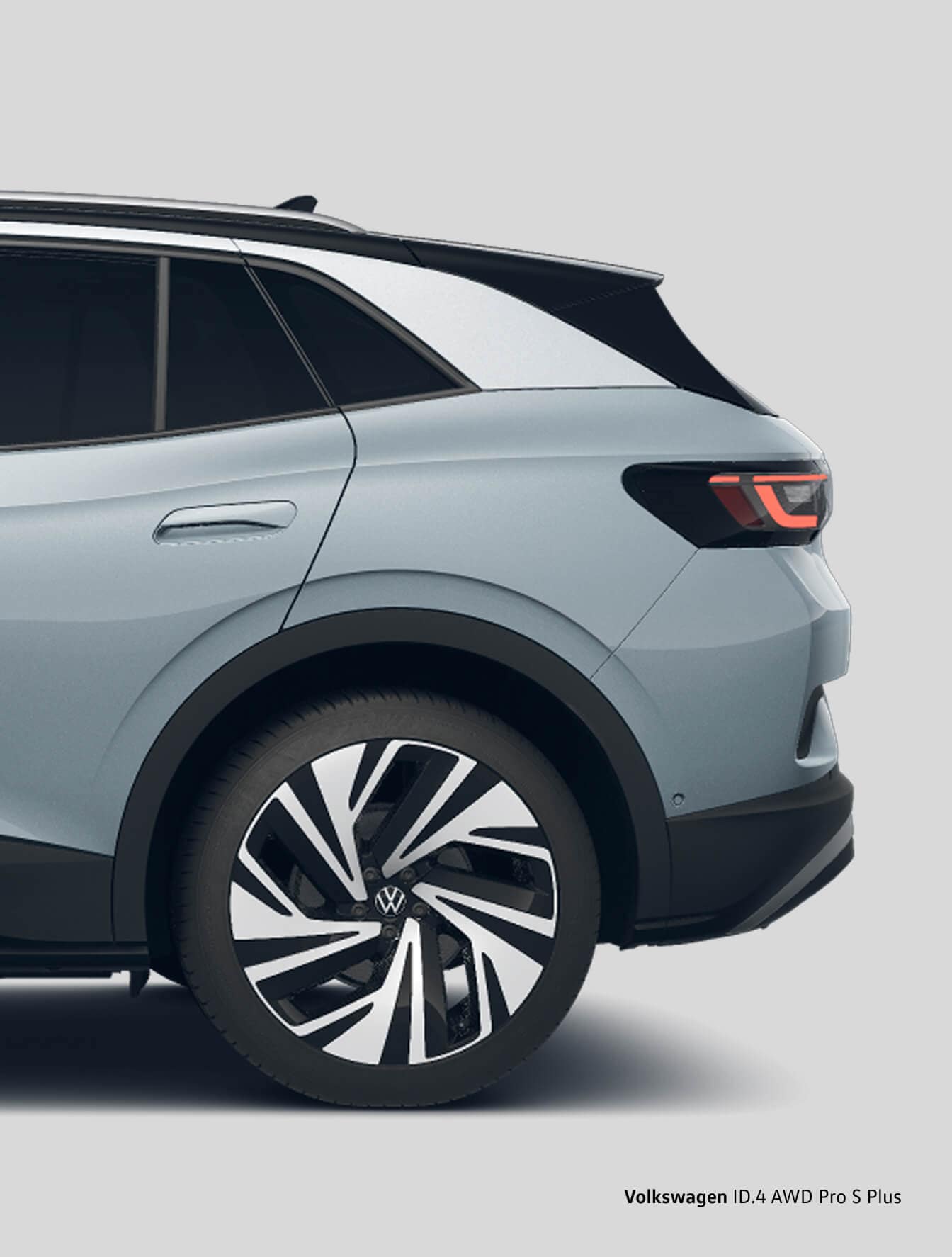 Close-up of Volkswagen ID.4 rear wheel and quarter panel highlighting sleek body lines and alloy wheel design