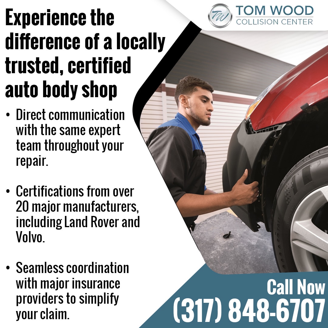 Certified auto body repair technician working on vehicle panel replacement at Tom Wood Collision Center in Indianapolis
