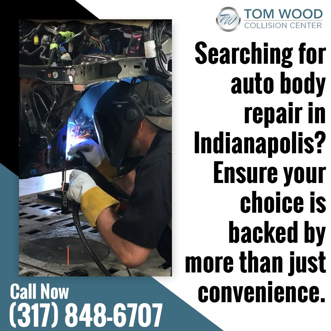 Collision repair technician performing welding on a vehicle frame at a certified auto body shop in Indianapolis