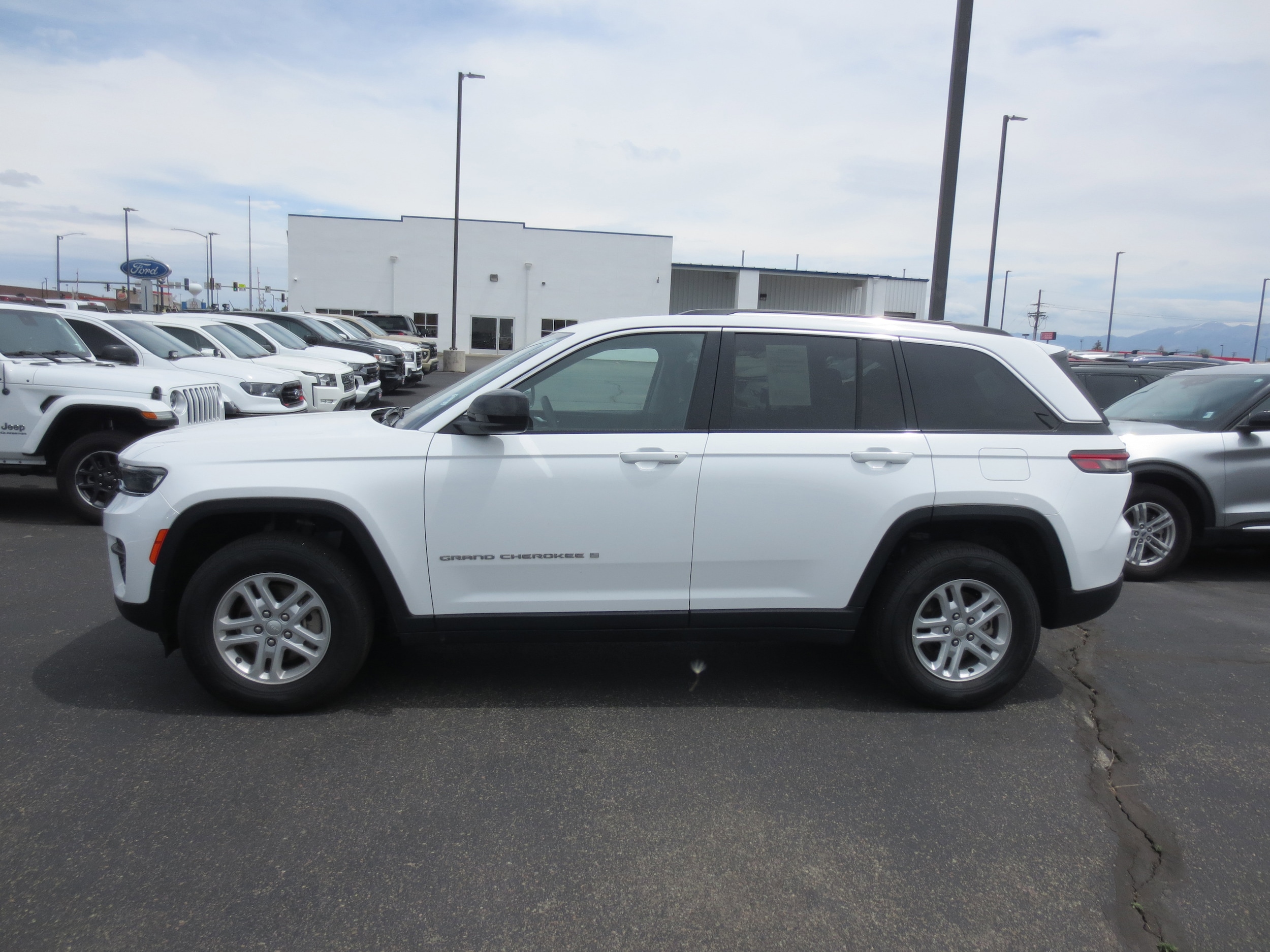 Used 2023 Jeep Grand Cherokee Laredo with VIN 1C4RJHAG5PC576318 for sale in Alamosa, CO