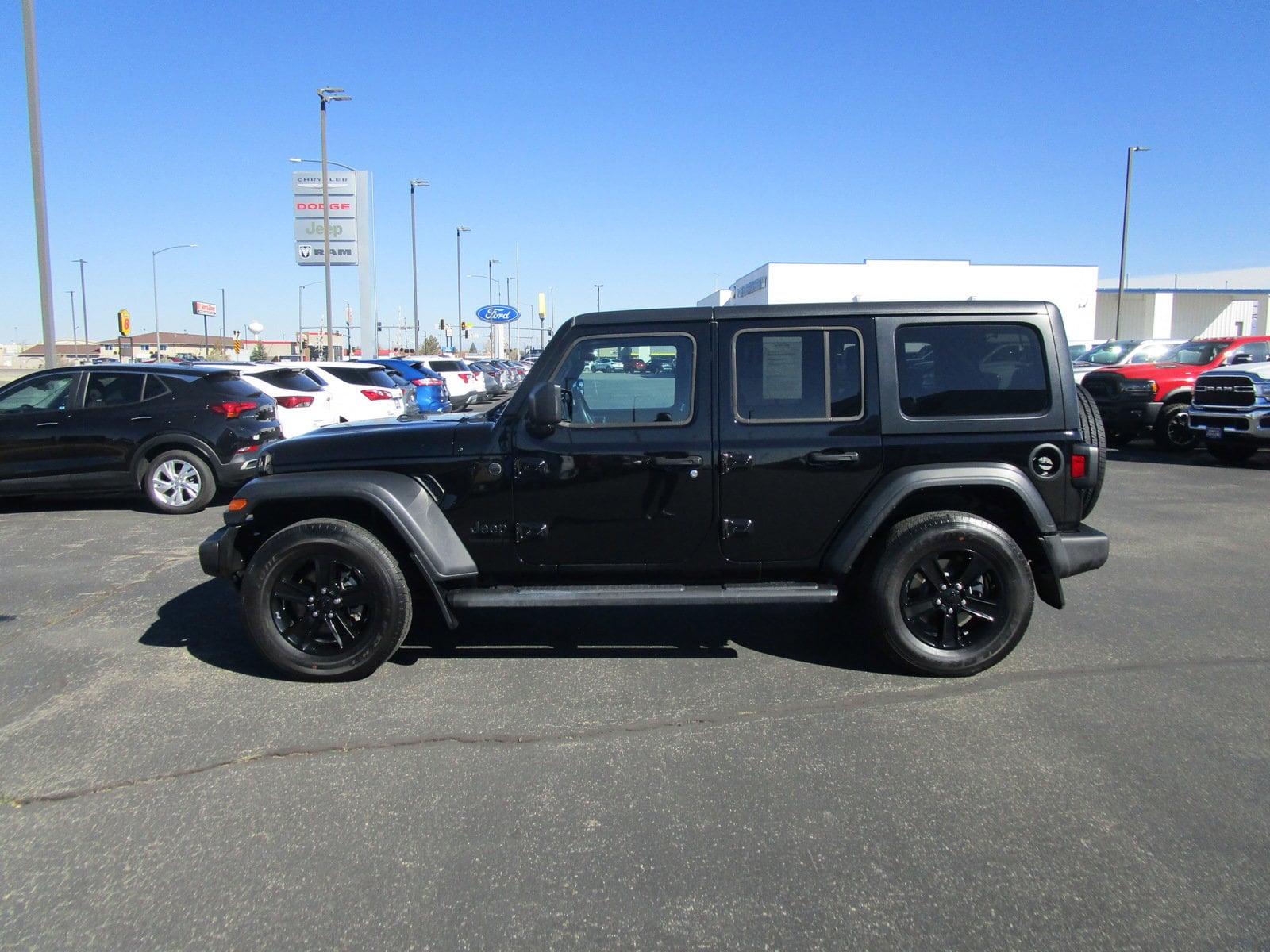 Used 2023 Jeep Wrangler 4-Door Altitude with VIN 1C4HJXDG1PW560617 for sale in Alamosa, CO