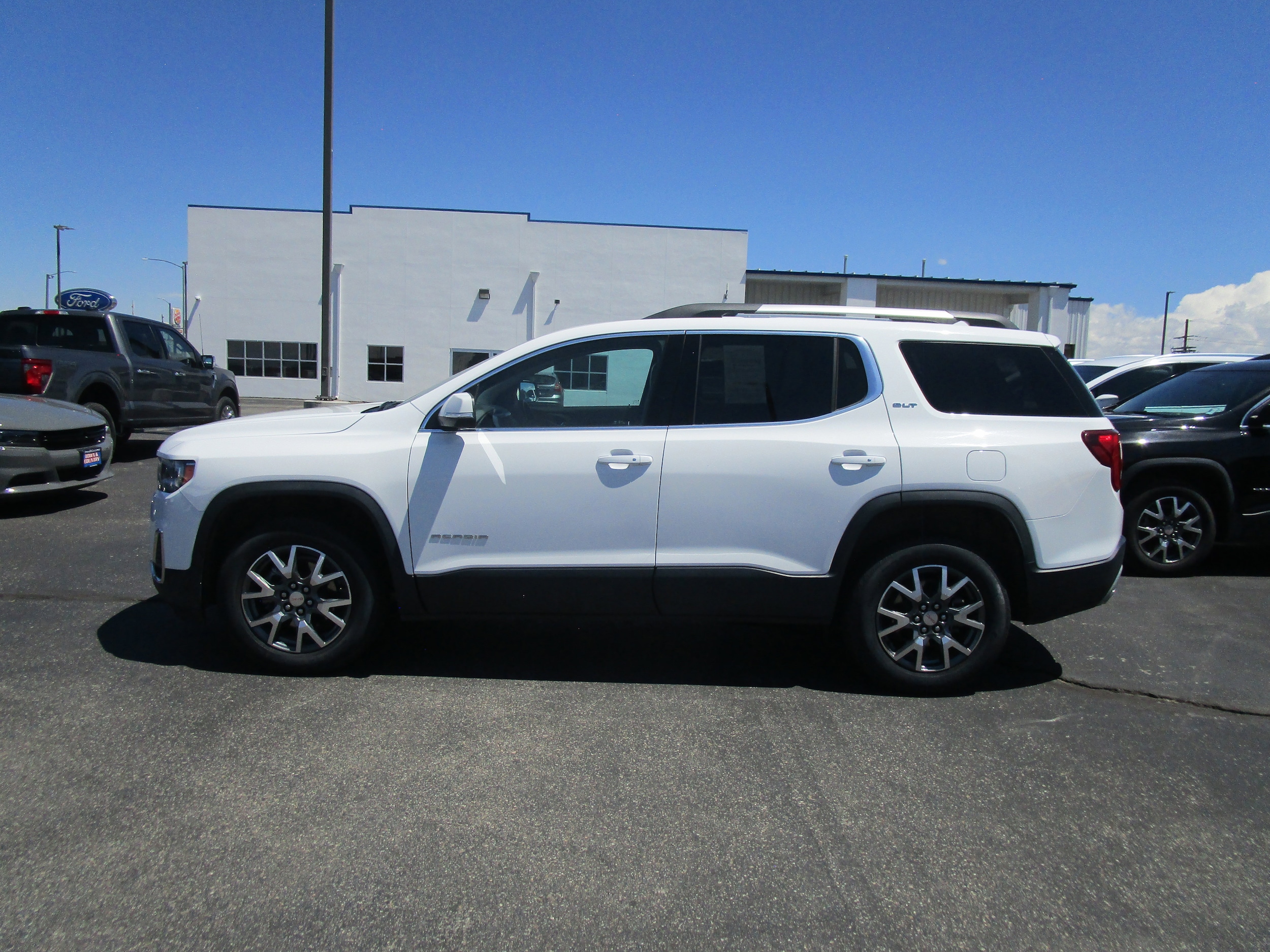 Used 2023 GMC Acadia SLT with VIN 1GKKNUL47PZ256372 for sale in Alamosa, CO