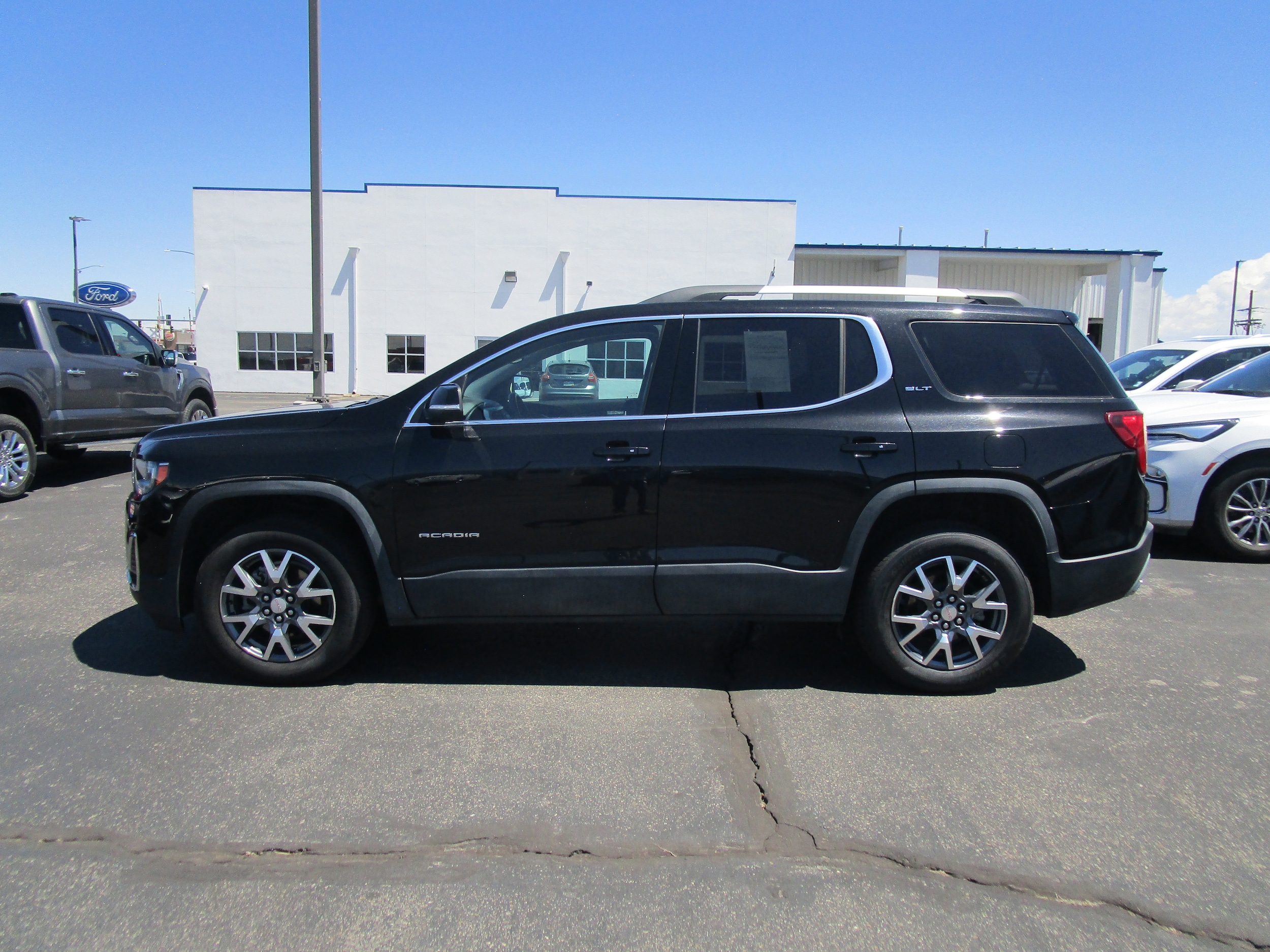 Used 2023 GMC Acadia SLT with VIN 1GKKNUL47PZ256405 for sale in Alamosa, CO