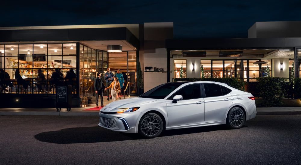 A silver 2025 Toyota Camry XSE is shown leaving a Toyota dealer in Hopkinsville.